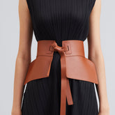 Full-length view of beige dress with belt.
